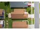Aerial view showing the home's footprint, roof, driveway, yard and proximity to neighboring homes at 284 Quane Ave, Spring Hill, FL 34609