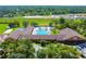 Aerial view shows the recreational center with pool at 284 Quane Ave, Spring Hill, FL 34609