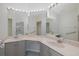 Bathroom featuring dual sinks, vanity with lots of counter space and custom lighting at 284 Quane Ave, Spring Hill, FL 34609