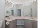 Bright bathroom with dual sinks, vanity lighting, and neutral finishes create a clean and functional space at 284 Quane Ave, Spring Hill, FL 34609