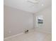 Bedroom with window and tile floor, providing a serene space at 284 Quane Ave, Spring Hill, FL 34609