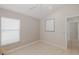 Bedroom with neutral walls, tile flooring, window, and modern lighting at 284 Quane Ave, Spring Hill, FL 34609