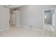 View of bedroom with tile flooring, ceiling fan and sliding glass door leading to patio at 284 Quane Ave, Spring Hill, FL 34609