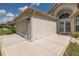 Charming single-Gathering home showcasing an attached garage and well-maintained exterior at 284 Quane Ave, Spring Hill, FL 34609