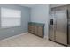 Bright kitchen features tile flooring, stainless steel refrigerator and plenty of cabinet space at 284 Quane Ave, Spring Hill, FL 34609