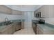 Functional kitchen design with a stainless steel dishwasher, stove, and ample counter space at 284 Quane Ave, Spring Hill, FL 34609