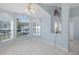 Inviting living space with tile flooring, high ceilings and large arched windows at 284 Quane Ave, Spring Hill, FL 34609