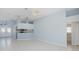 Spacious living area with tile flooring leading into the open kitchen and dining area at 284 Quane Ave, Spring Hill, FL 34609