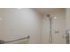 Bright bathroom shower with white tiled walls, grab bar, and modern shower head at 284 Quane Ave, Spring Hill, FL 34609