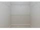 Walk-in closet with adjustable shelving and tile flooring at 284 Quane Ave, Spring Hill, FL 34609