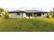 Well-manicured backyard and patio area complements this single story home's exterior at 305 Yellow Elder, Punta Gorda, FL 33955