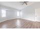 Spacious bedroom with a ceiling fan, shuttered windows, and luxury vinyl plank flooring at 305 Yellow Elder, Punta Gorda, FL 33955