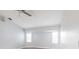 Bright bedroom featuring a ceiling fan, neutral walls and plantation shutters at 305 Yellow Elder, Punta Gorda, FL 33955