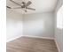 Bright bedroom features modern ceiling fan, light-colored walls, and wood-look laminate flooring at 305 Yellow Elder, Punta Gorda, FL 33955