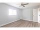 Light-filled bedroom featuring wood floors and a ceiling fan at 305 Yellow Elder, Punta Gorda, FL 33955