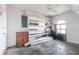This garage features white walls, open shelving, an arched window, and a ceiling fan at 305 Yellow Elder, Punta Gorda, FL 33955