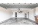 Spacious two car garage with a garage door, and utility equipment at 305 Yellow Elder, Punta Gorda, FL 33955