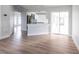 Open-concept living area with kitchen view featuring modern appliances and bar seating at 305 Yellow Elder, Punta Gorda, FL 33955