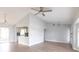 Bright living area showcasing open layout into kitchen with modern lighting fixtures at 305 Yellow Elder, Punta Gorda, FL 33955