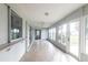 Bright sunroom with multiple glass windows, neutral walls, and tiled floors at 305 Yellow Elder, Punta Gorda, FL 33955