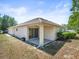 Backyard featuring a covered patio with sliding glass doors and landscaping at 3885 Crossline Dr, Spring Hill, FL 34609