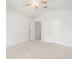 Neutral bedroom featuring high ceilings and two closets at 3885 Crossline Dr, Spring Hill, FL 34609