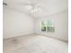 Bright and airy bedroom featuring a ceiling fan and ample natural light at 3885 Crossline Dr, Spring Hill, FL 34609