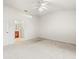 Bedroom with light-colored carpet and attached bathroom at 3885 Crossline Dr, Spring Hill, FL 34609