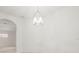 Charming dining area with a stylish chandelier, offering a cozy and elegant space for gatherings and meals at 3885 Crossline Dr, Spring Hill, FL 34609