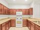 Efficient kitchen featuring wood cabinets and modern appliances at 3885 Crossline Dr, Spring Hill, FL 34609