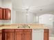 Contemporary kitchen featuring granite countertops and wood cabinets at 3885 Crossline Dr, Spring Hill, FL 34609