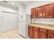 This kitchen features tile floors and granite countertops at 3885 Crossline Dr, Spring Hill, FL 34609