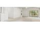 Bright, spacious living area with sliding glass doors providing natural light and access to the outdoors at 3885 Crossline Dr, Spring Hill, FL 34609