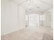 Spacious living room with architectural columns and carpeted flooring at 3885 Crossline Dr, Spring Hill, FL 34609