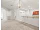 Bright open floor plan featuring an open view to the kitchen and white paint at 3885 Crossline Dr, Spring Hill, FL 34609