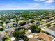 Aerial view of a residential neighborhood showcasing well-maintained homes and lush landscaping at 4330 Crosswhite Ct, Spring Hill, FL 34609