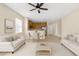 An open-concept living space includes the kitchen, dining, and living areas with neutral tones at 4330 Crosswhite Ct, Spring Hill, FL 34609