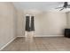 Spacious living area with neutral paint, tile flooring, and an archway to another room at 4330 Crosswhite Ct, Spring Hill, FL 34609