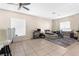 A living room shows tile floors, a ceiling fan, and a work space at 4330 Crosswhite Ct, Spring Hill, FL 34609