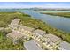Aerial shot showing townhomes nestled near a river, enhanced by scenic views at 4740 Tuscan Loon Dr, Tampa, FL 33619