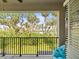 Balcony showcasing stunning views of lush palm trees, offering privacy and tranquility at 4740 Tuscan Loon Dr, Tampa, FL 33619