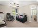 Bedroom area featuring a desk and computer workstation, a ceiling fan and comfortable seating at 4740 Tuscan Loon Dr, Tampa, FL 33619