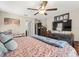 Comfortable bedroom with ceiling fan and dresser, providing storage and space at 4740 Tuscan Loon Dr, Tampa, FL 33619