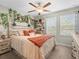 Charming bedroom featuring custom shelving, dual windows and neutral walls and decor at 4740 Tuscan Loon Dr, Tampa, FL 33619