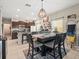 Open dining area seamlessly connecting to the kitchen, complete with a modern pendant light at 4740 Tuscan Loon Dr, Tampa, FL 33619