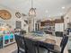 Bright dining area featuring a table with seating, stylish decor, and a modern lighting fixture at 4740 Tuscan Loon Dr, Tampa, FL 33619