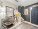Inviting entryway with decorative table and mirror, leading to a staircase at 4740 Tuscan Loon Dr, Tampa, FL 33619