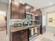 Kitchen with stainless steel appliances, granite countertops, and plenty of storage space at 4740 Tuscan Loon Dr, Tampa, FL 33619