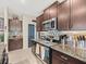 Contemporary kitchen featuring stainless steel appliances, granite countertops and ample storage space at 4740 Tuscan Loon Dr, Tampa, FL 33619