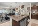 Spacious kitchen with a large island, stainless steel appliances, and open to the dining and living areas at 4740 Tuscan Loon Dr, Tampa, FL 33619